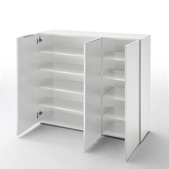 Interior view of shelves holding 32 pairs of shoes.