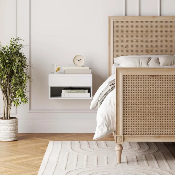 Close-up of boho modern nightstand in a compact bedroom