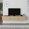 Oak & Caraz floating TV stand with three cabinets mounted on wall — fits TVs up to 65 inches